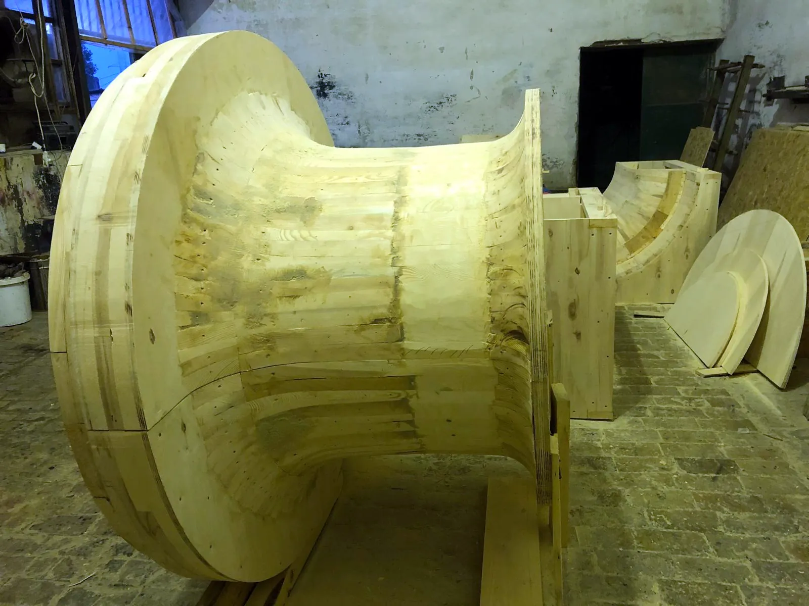 Large turned wooden pattern built from glued segments, before finishing